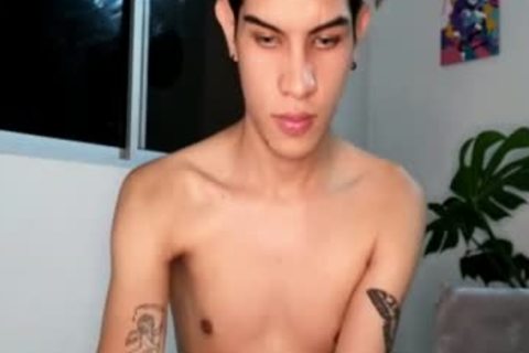 Skinny Latino teen With Tattoos And Earings Teases On web camera